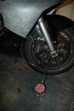 Bocal réceptionnant le liquide usagé